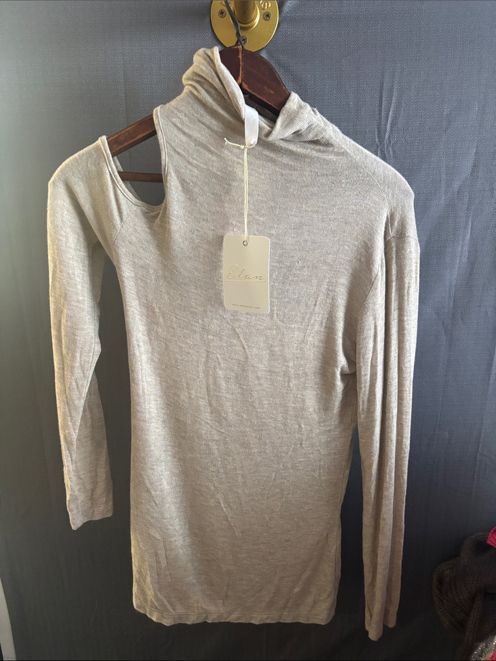 NWT soft Cashmere feel .A new take on a turtleneck with sexy one shoulder out